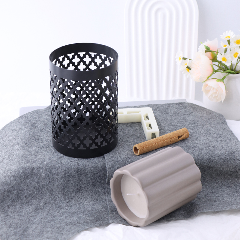 Modern Black Metal Candle Holder with Carved Design